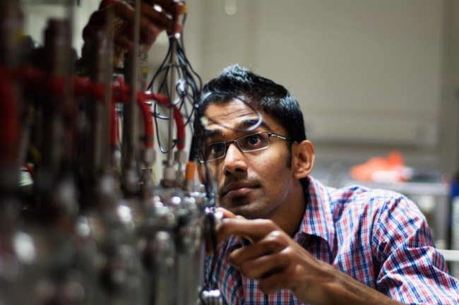 Man doing research and development in an industrial setting.