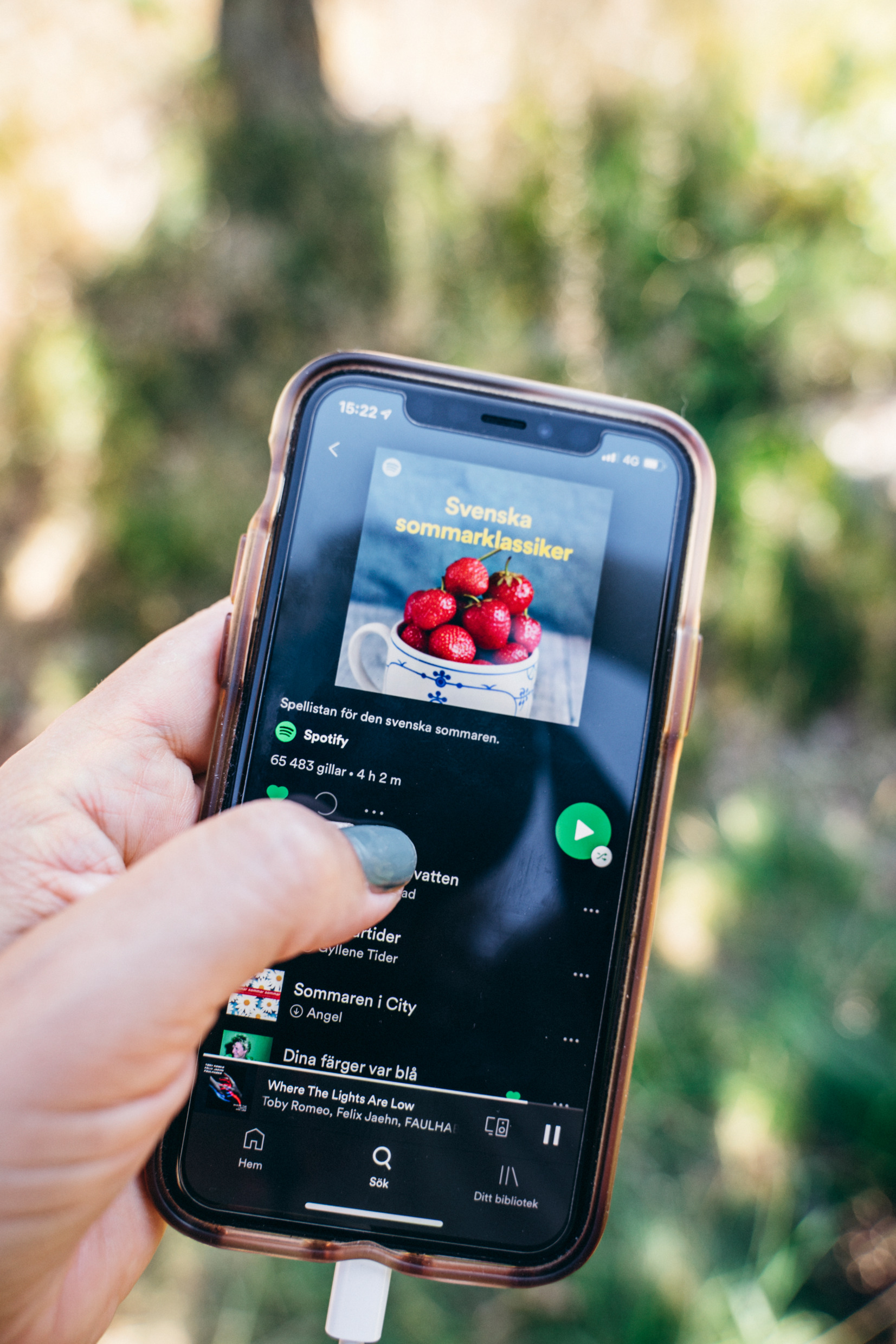 Phone showing screen with Spotify app