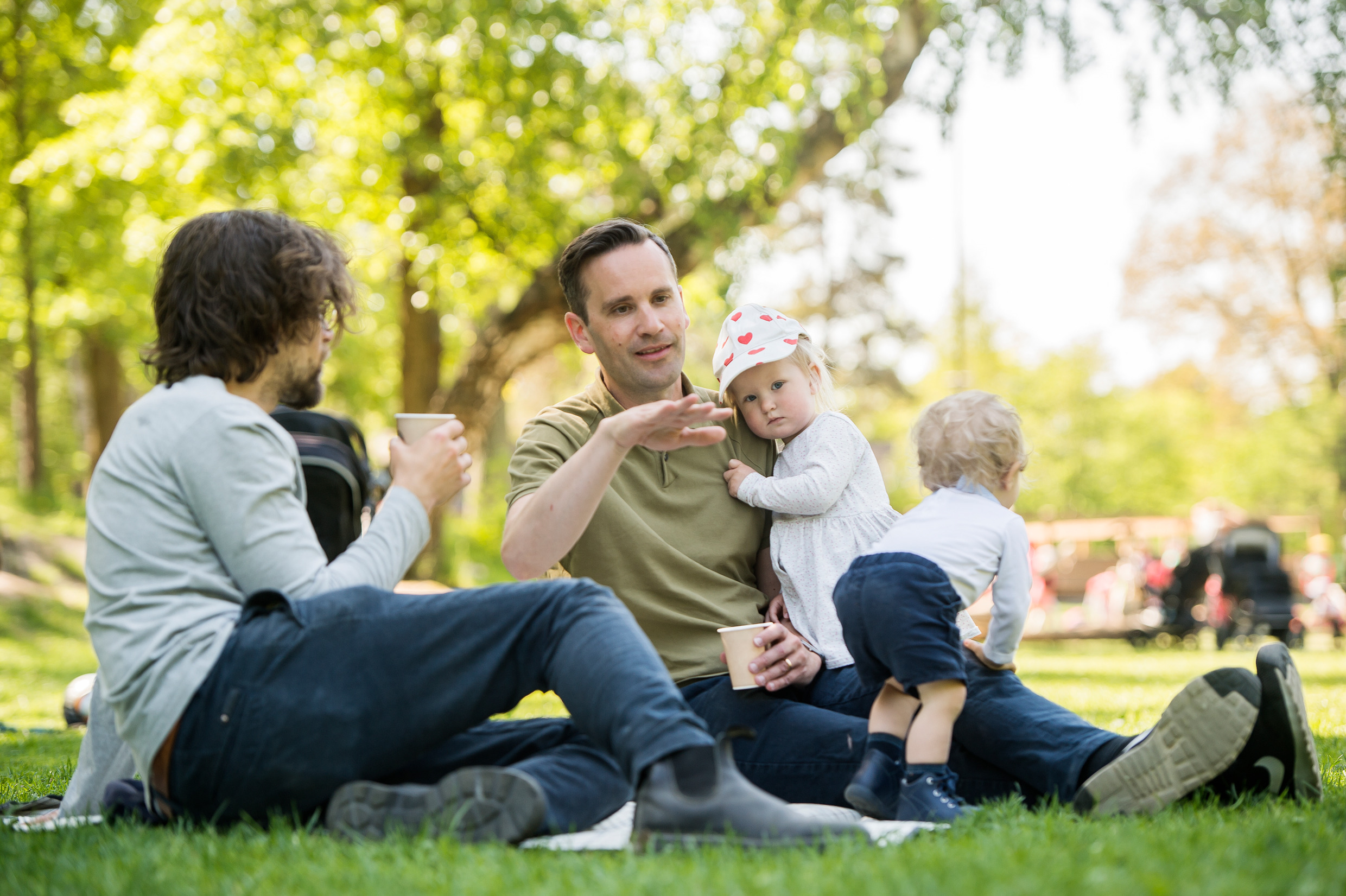 Family sitting outside on grass