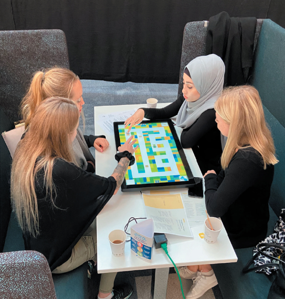 Photo of women using digital screen